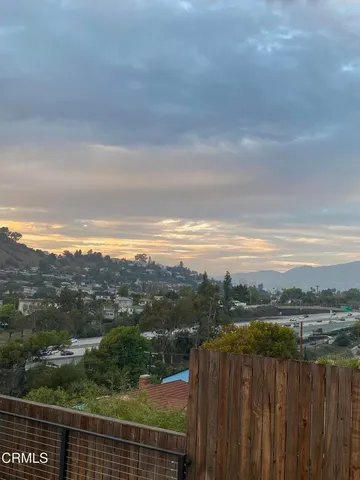 a view of a balcony with lake view and mountain view