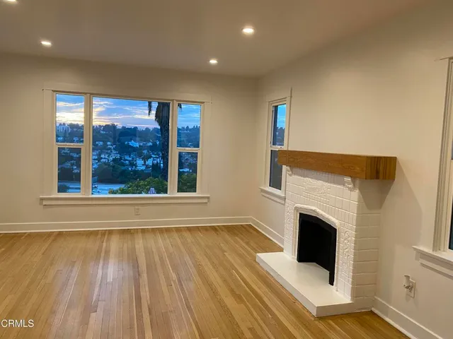 a view of livingroom with furniture wooden floor and fireplace