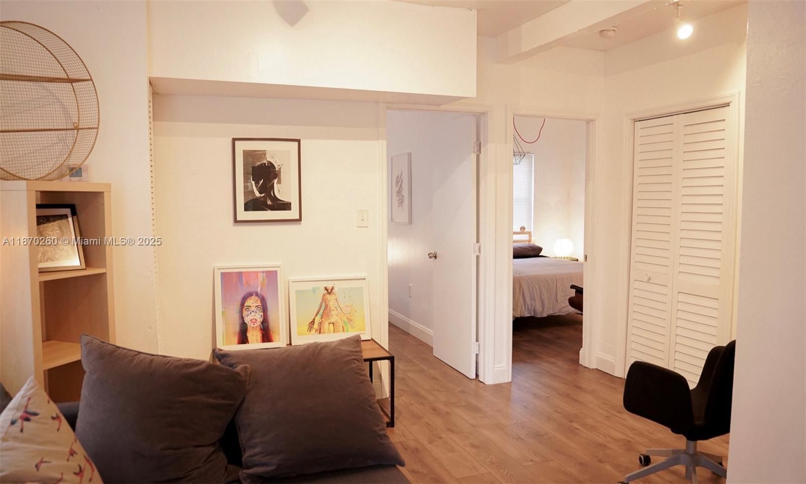 68 Northwest 45th Street, Unit 2 Miami, FL 33127 - Photo 4 of 20 a living room with furniture and a gate