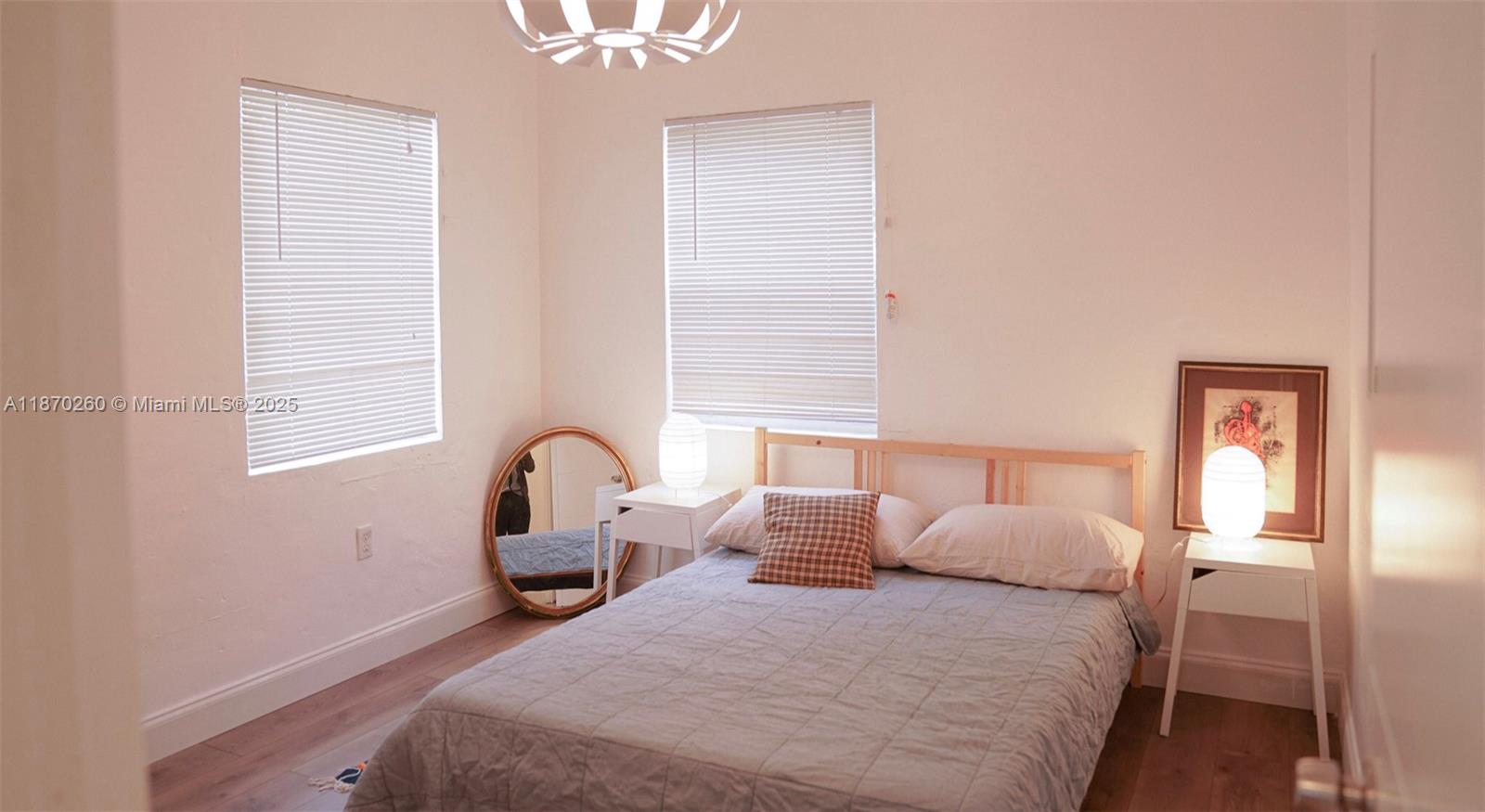 68 Northwest 45th Street, Unit 2 Miami, FL 33127 - Photo 8 of 20 a bedroom with bed and window