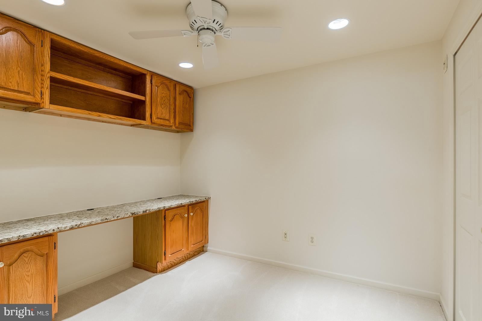 3622 Beaver Ford Road Woodbridge, VA 22192 - Photo 22 of 25 Basement Office. Built in desk, lighting, fan.