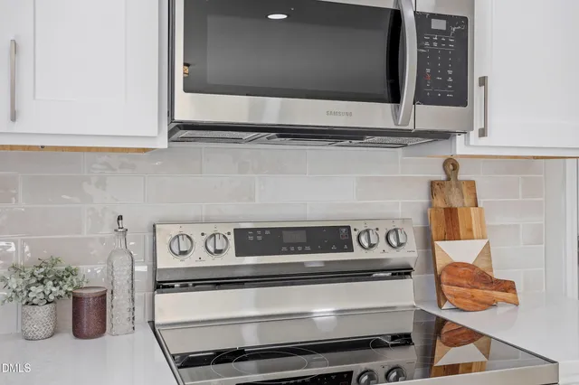 a kitchen with a stove and cabinets