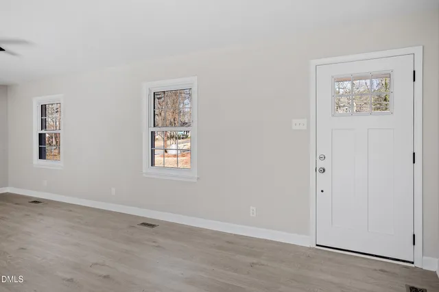 a view of an empty room with a window