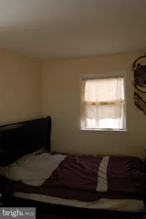 a room with a bed and a window