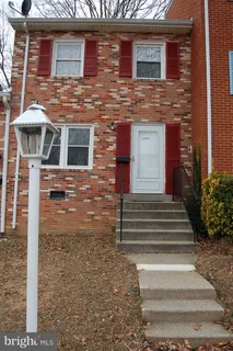 a front view of a house with stairs