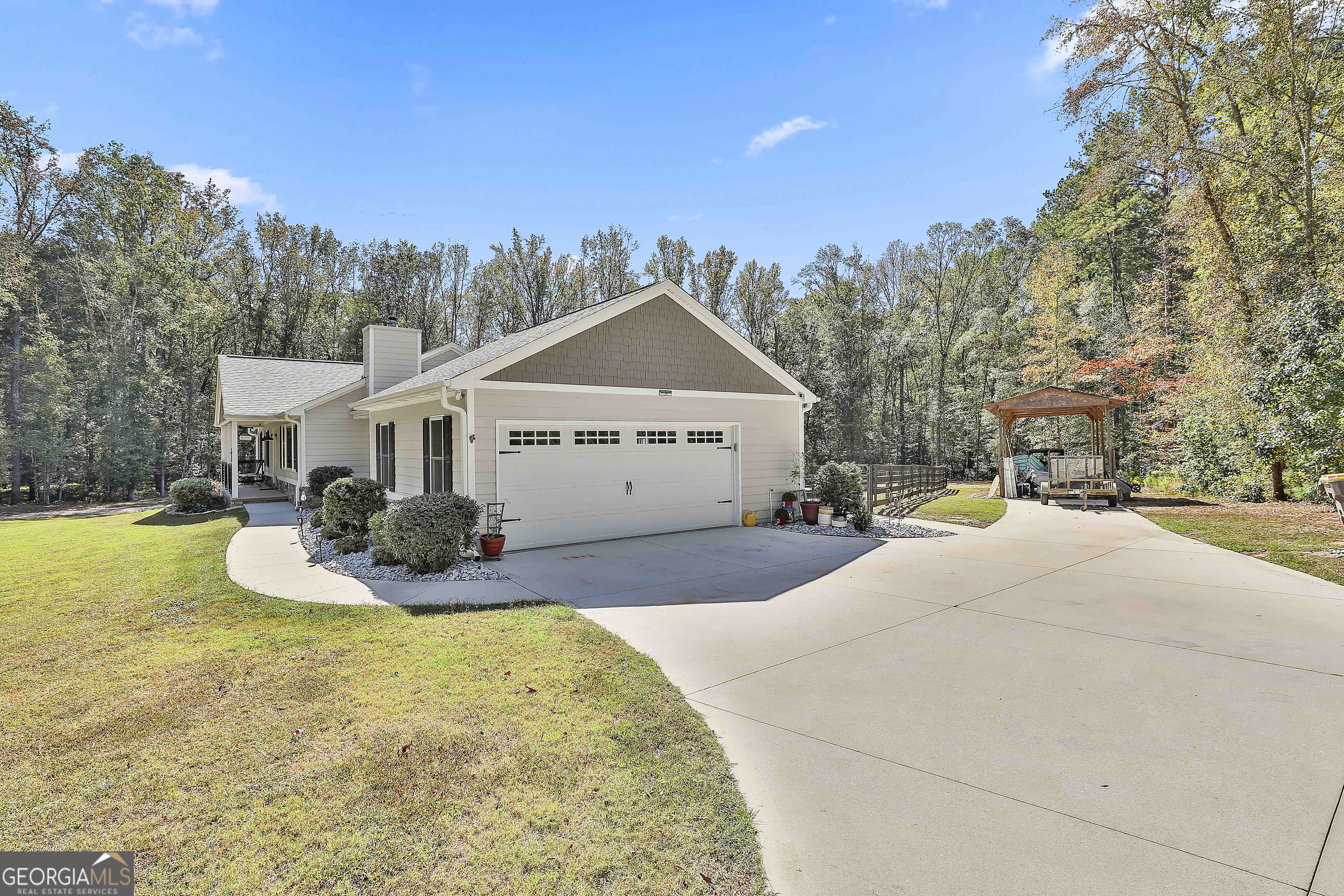 465 Little Road Sharpsburg, GA 30277 - Photo 12 of 67 a very nice looking house with a big yard and large trees