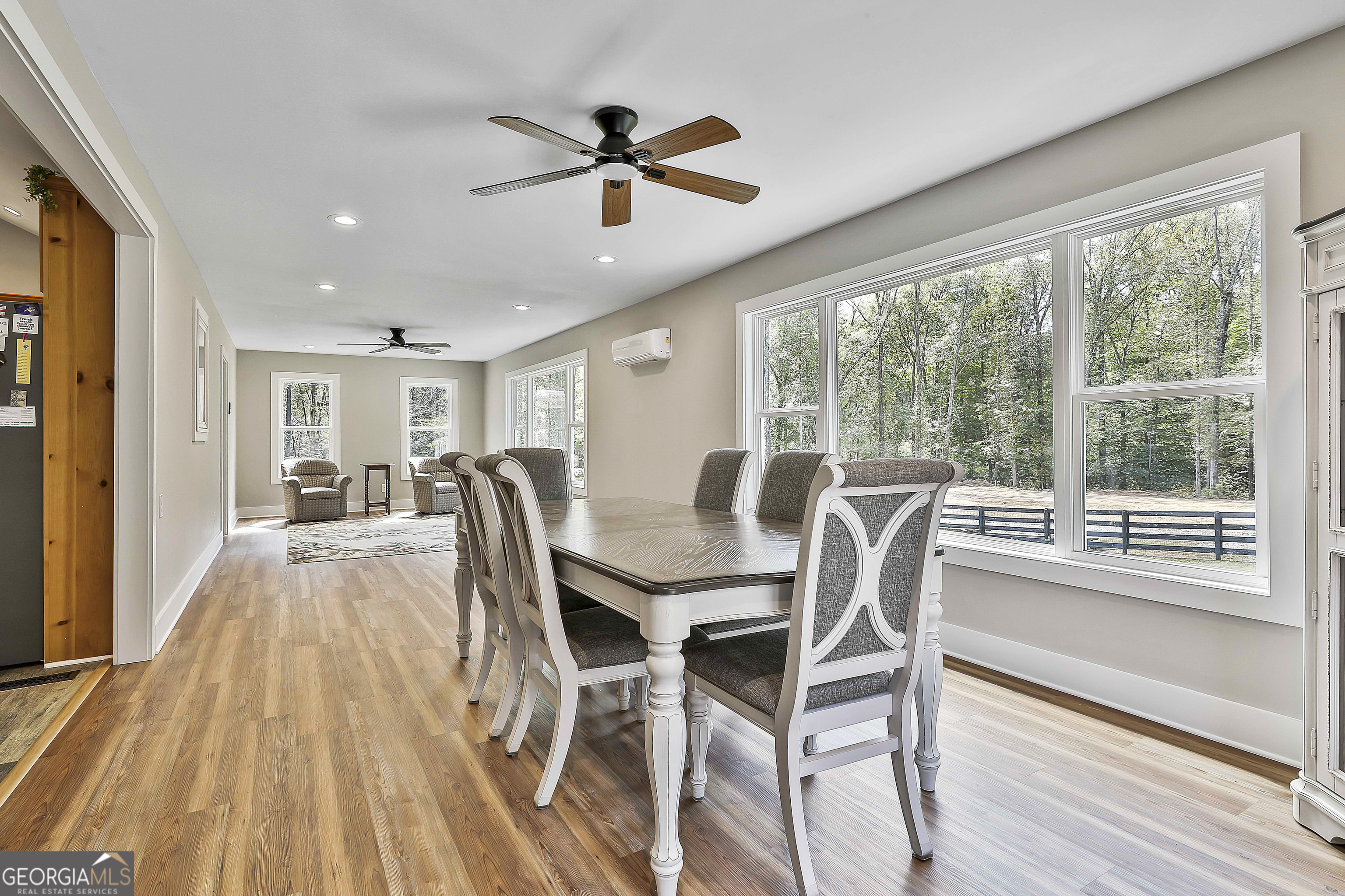 465 Little Road Sharpsburg, GA 30277 - Photo 18 of 67 a view of a dining room with furniture window and wooden floor