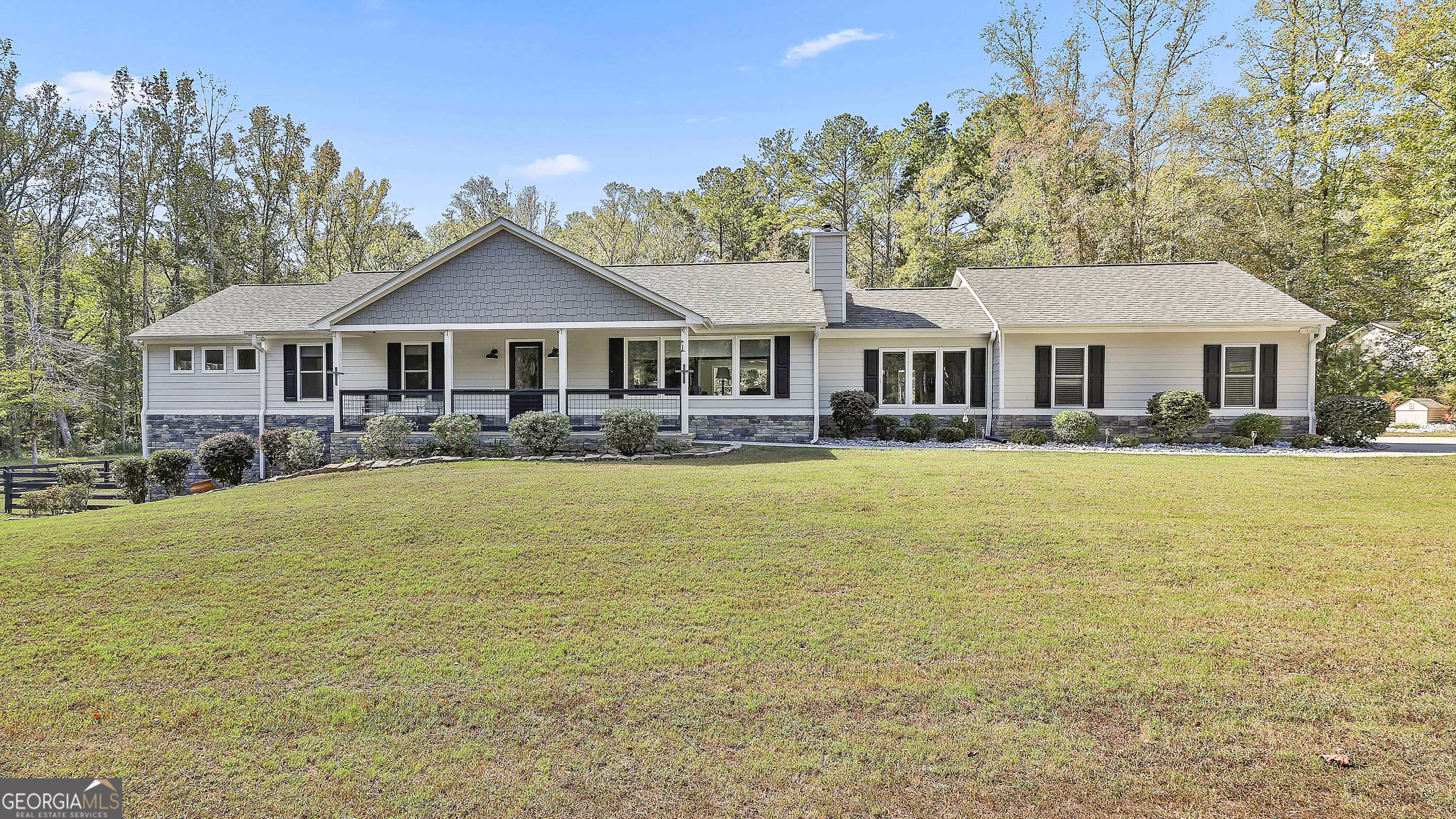 465 Little Road Sharpsburg, GA 30277 - Photo 2 of 67 a front view of a house with swimming pool and porch