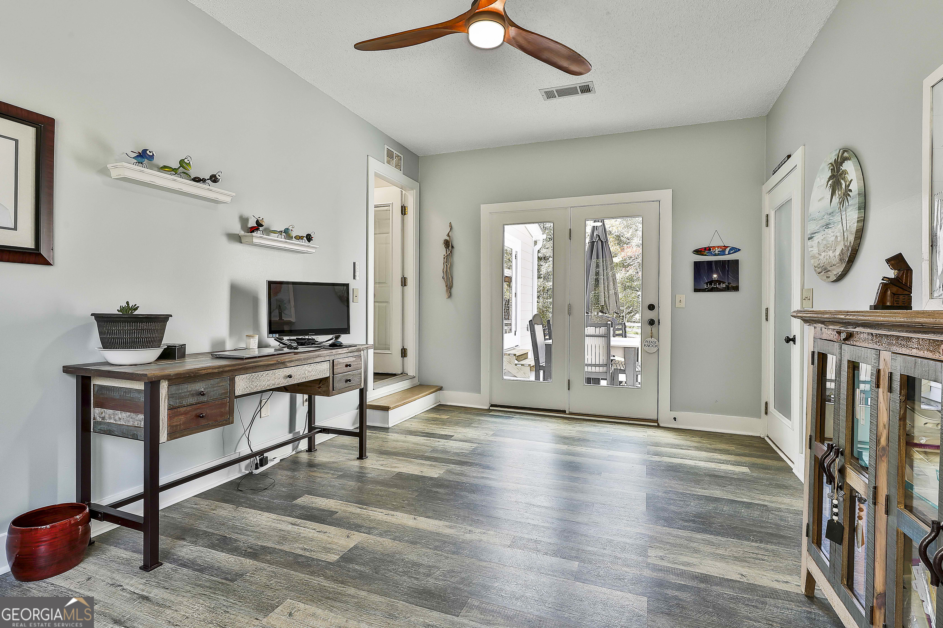 465 Little Road Sharpsburg, GA 30277 - Photo 23 of 67 a living room with furniture a flat screen tv and a fireplace