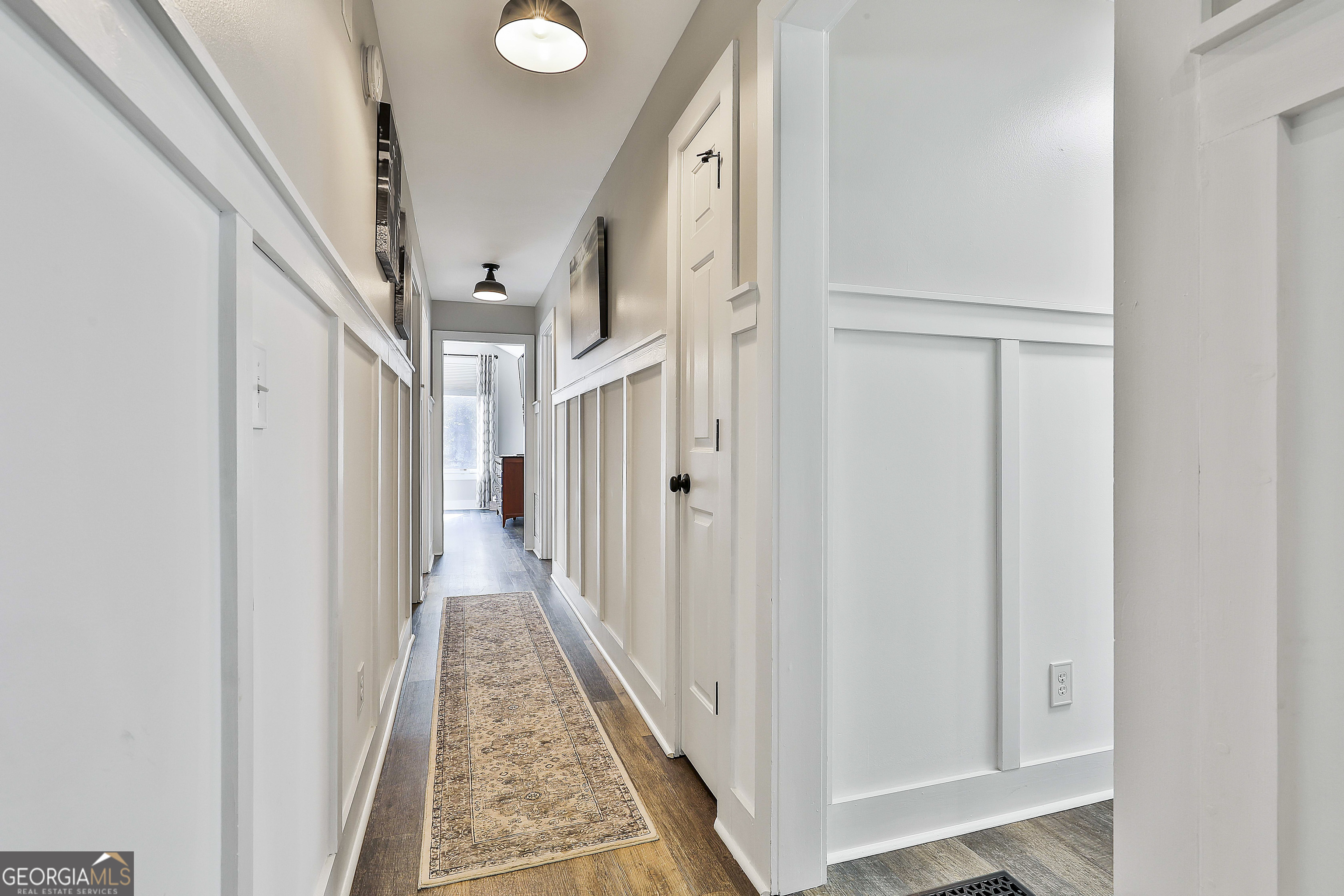465 Little Road Sharpsburg, GA 30277 - Photo 24 of 67 a view of a hallway with a white walls and stairs