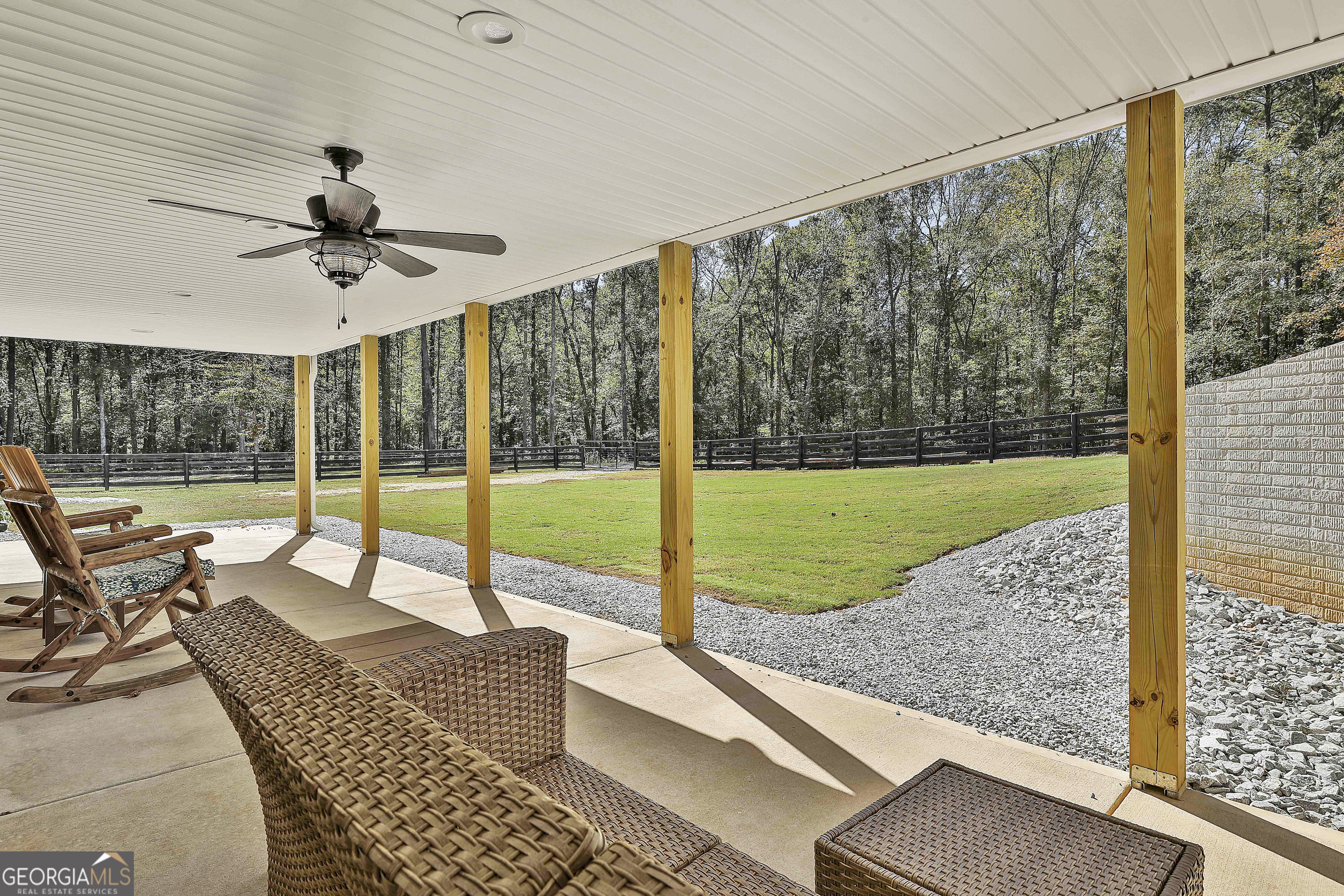 465 Little Road Sharpsburg, GA 30277 - Photo 26 of 67 a living room with a large window and a table