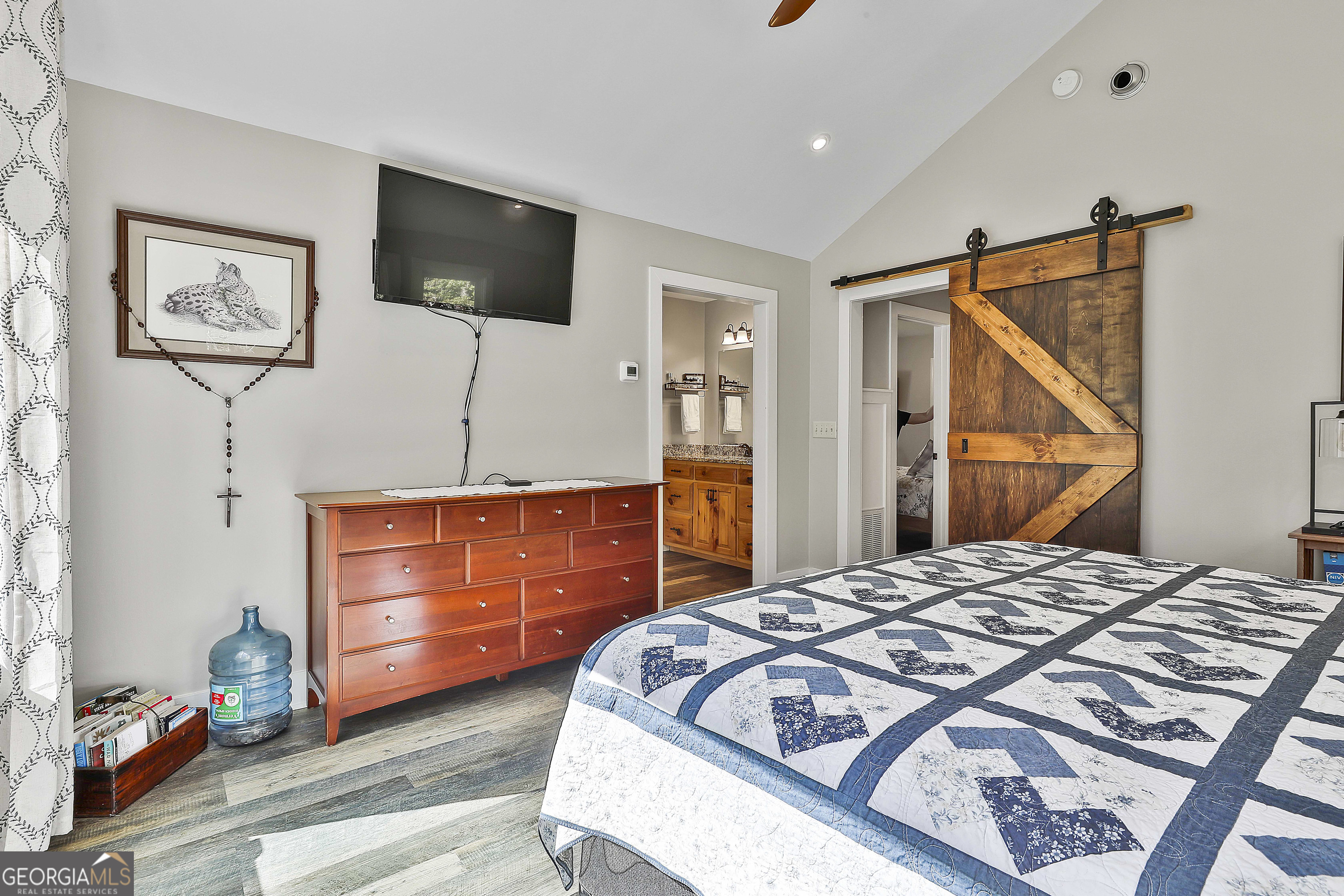 465 Little Road Sharpsburg, GA 30277 - Photo 28 of 67 a bedroom with a bed and a flat screen tv