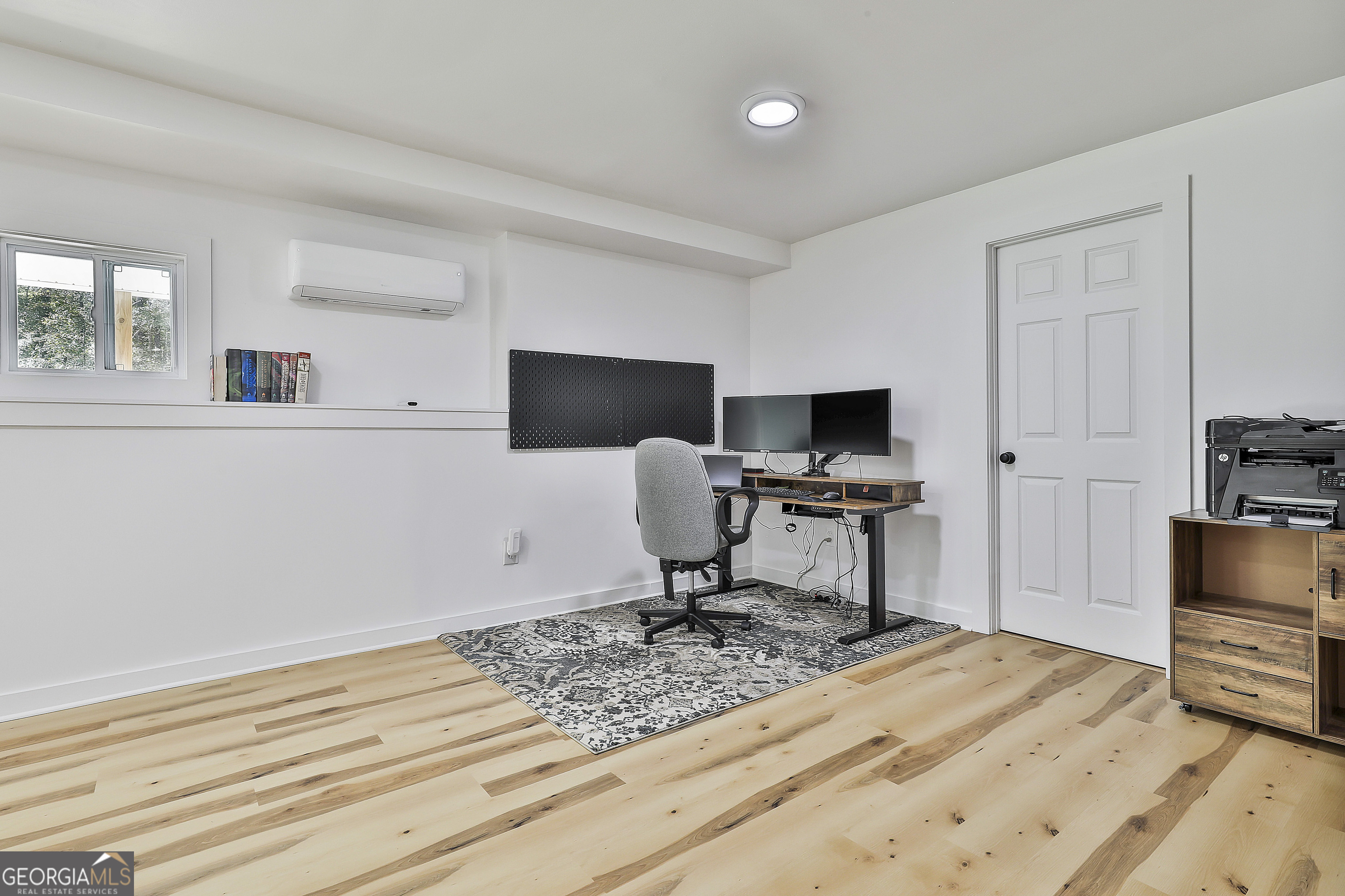 465 Little Road Sharpsburg, GA 30277 - Photo 38 of 67 a view of a workspace with furniture and a window