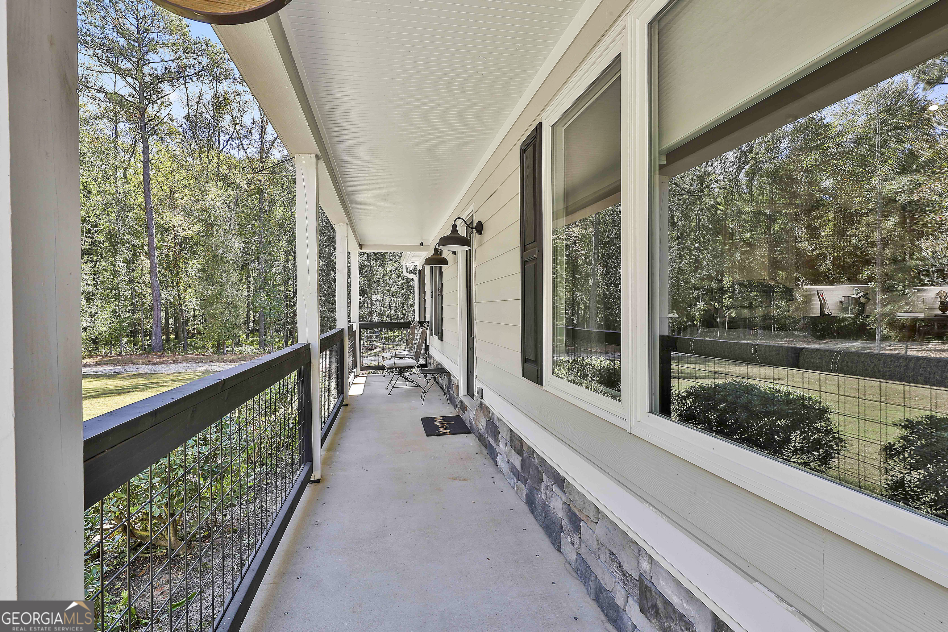465 Little Road Sharpsburg, GA 30277 - Photo 53 of 67 a view of a balcony with lake view and a potted plant