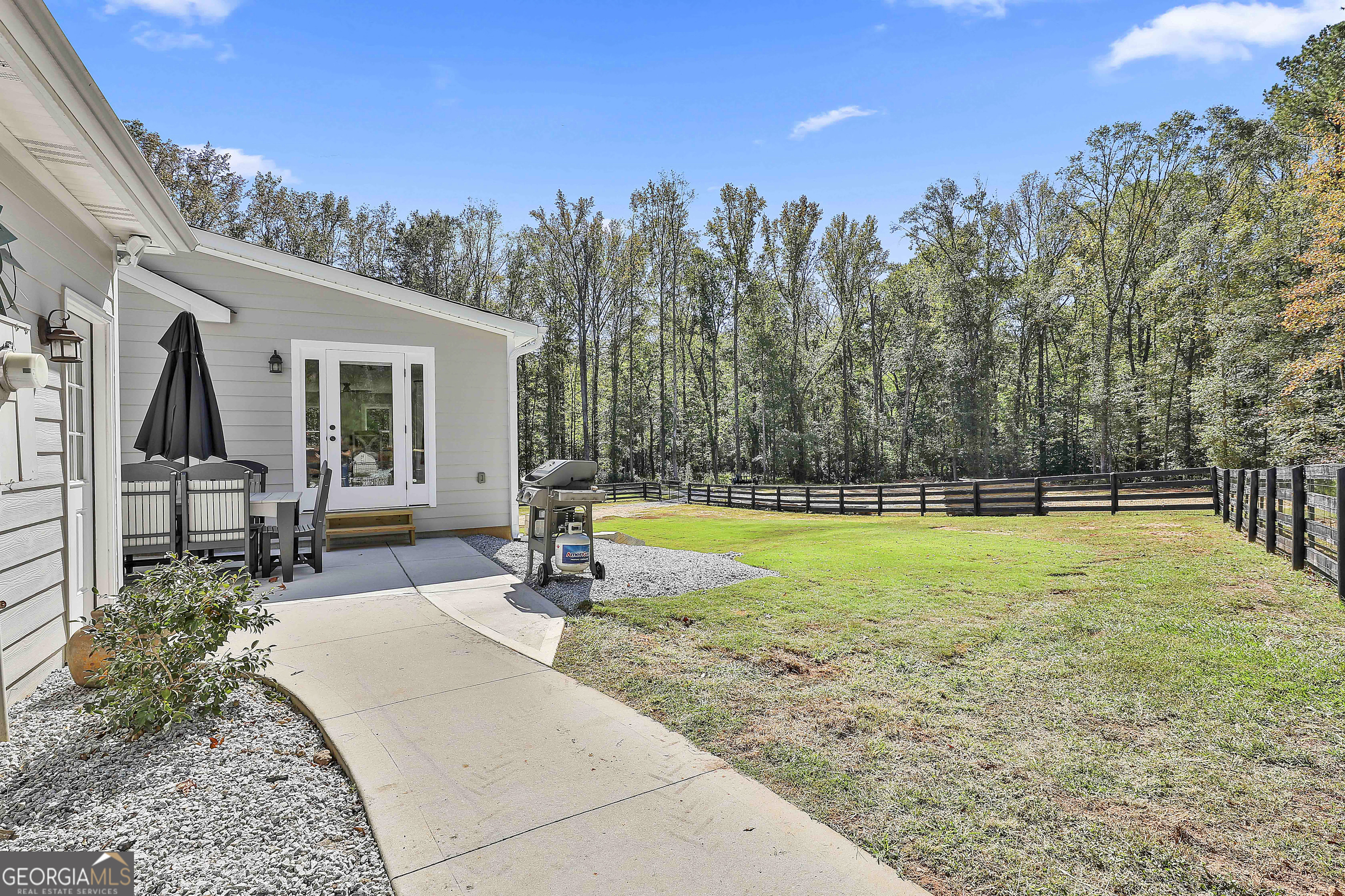 465 Little Road Sharpsburg, GA 30277 - Photo 57 of 67 a swimming pool with outdoor seating and yard