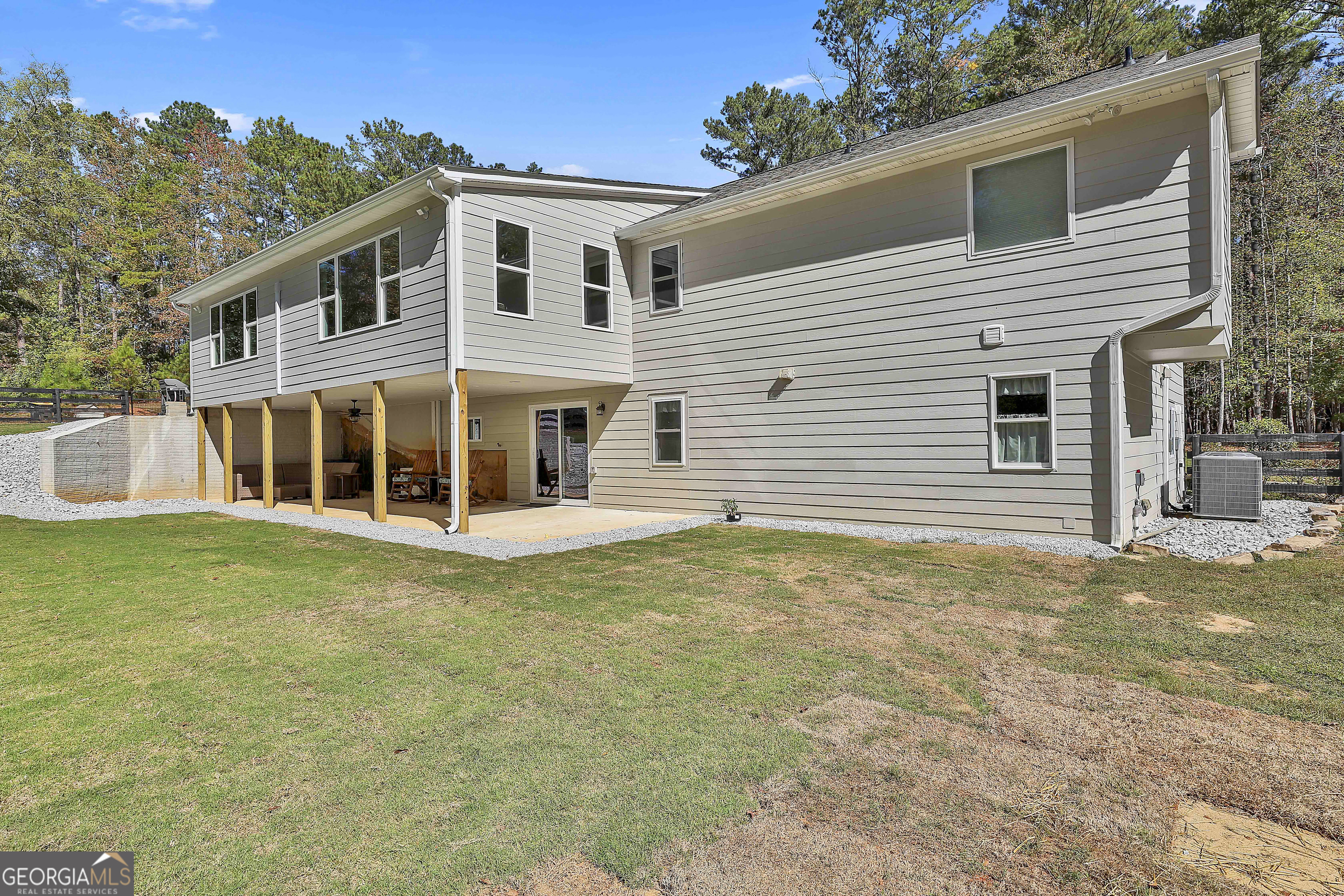 465 Little Road Sharpsburg, GA 30277 - Photo 61 of 67 a front view of a house with a garden