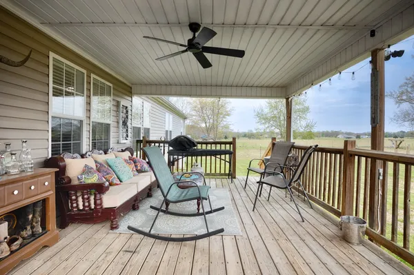 a balcony view with a seating space