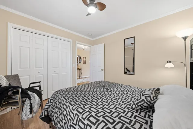 a bedroom with a bed and dresser