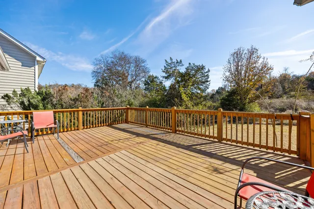 a view of deck with wooden floor and outdoor seating