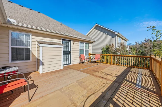 a balcony with a potted plant on the side