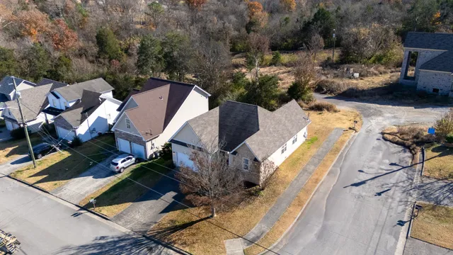an aerial view of a house with outdoor space