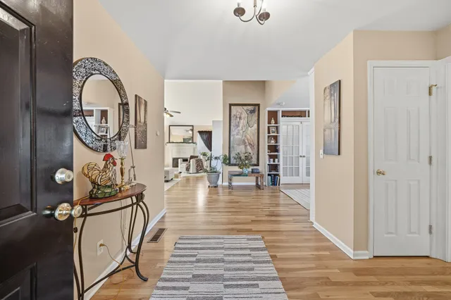 a view of a livingroom with furniture and entryway
