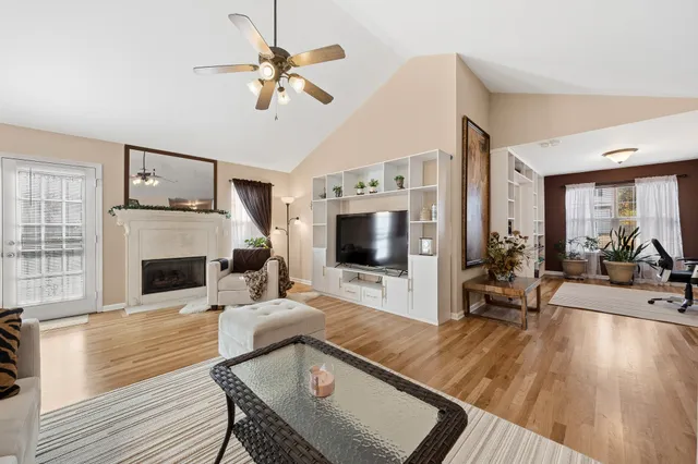 a living room with furniture fireplace and flat screen tv