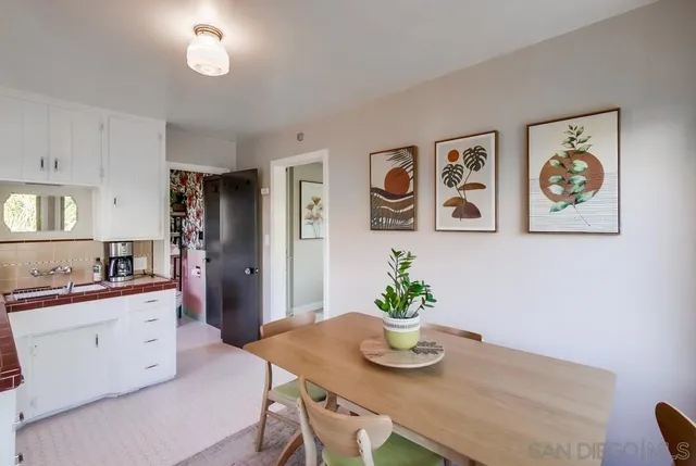 a kitchen with a table and cabinets