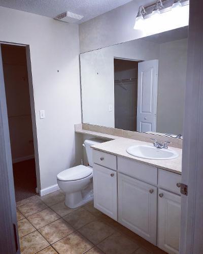 225 Murcia Drive, Unit 208 Jupiter, FL 33458 - Photo 19 of 32 a bathroom with a sink and a toilet