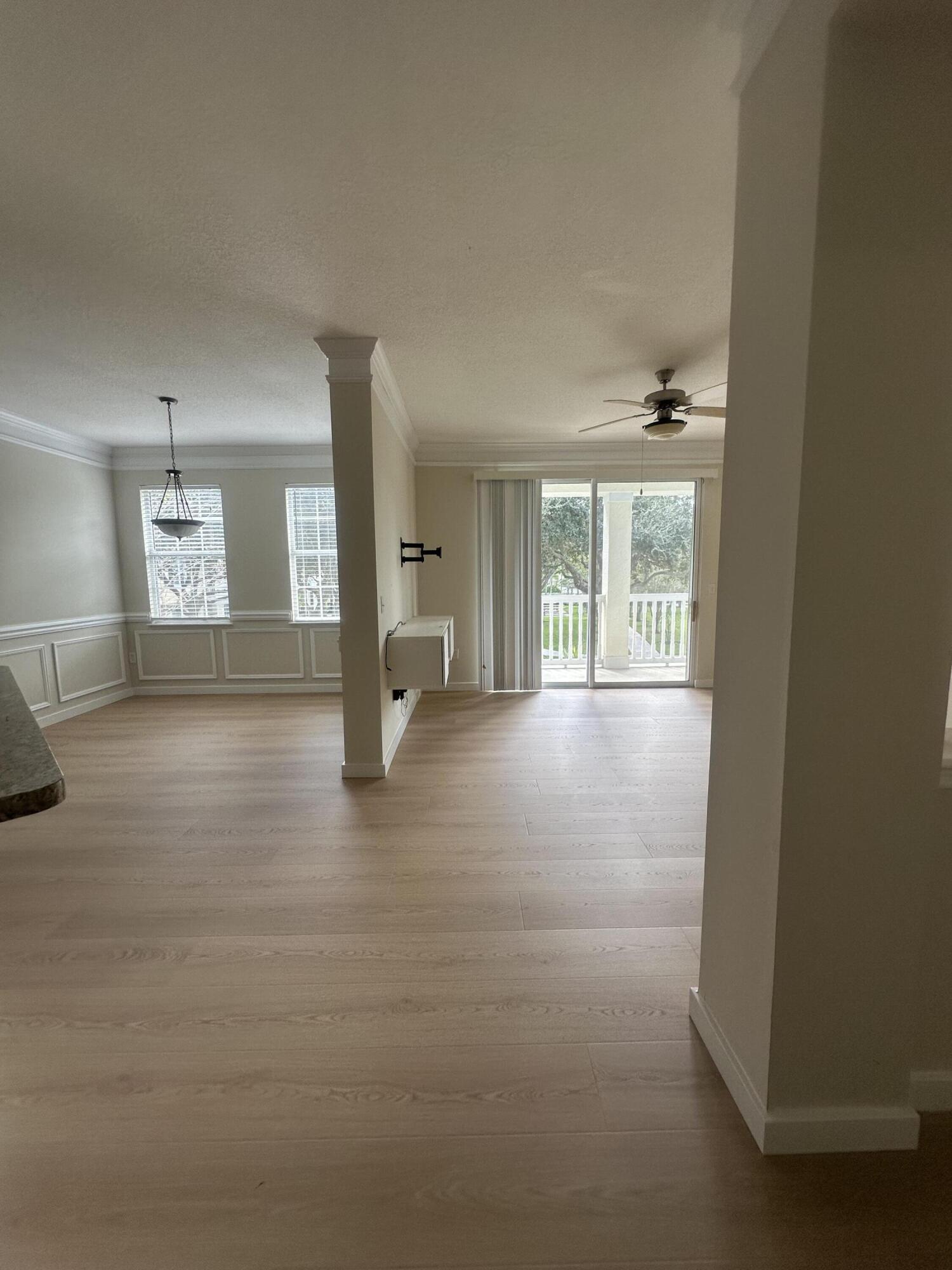 225 Murcia Drive, Unit 208 Jupiter, FL 33458 - Photo 2 of 32 an empty room with windows