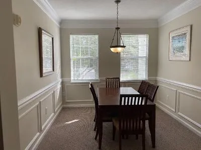 a view of a dining room with furniture window and outside view
