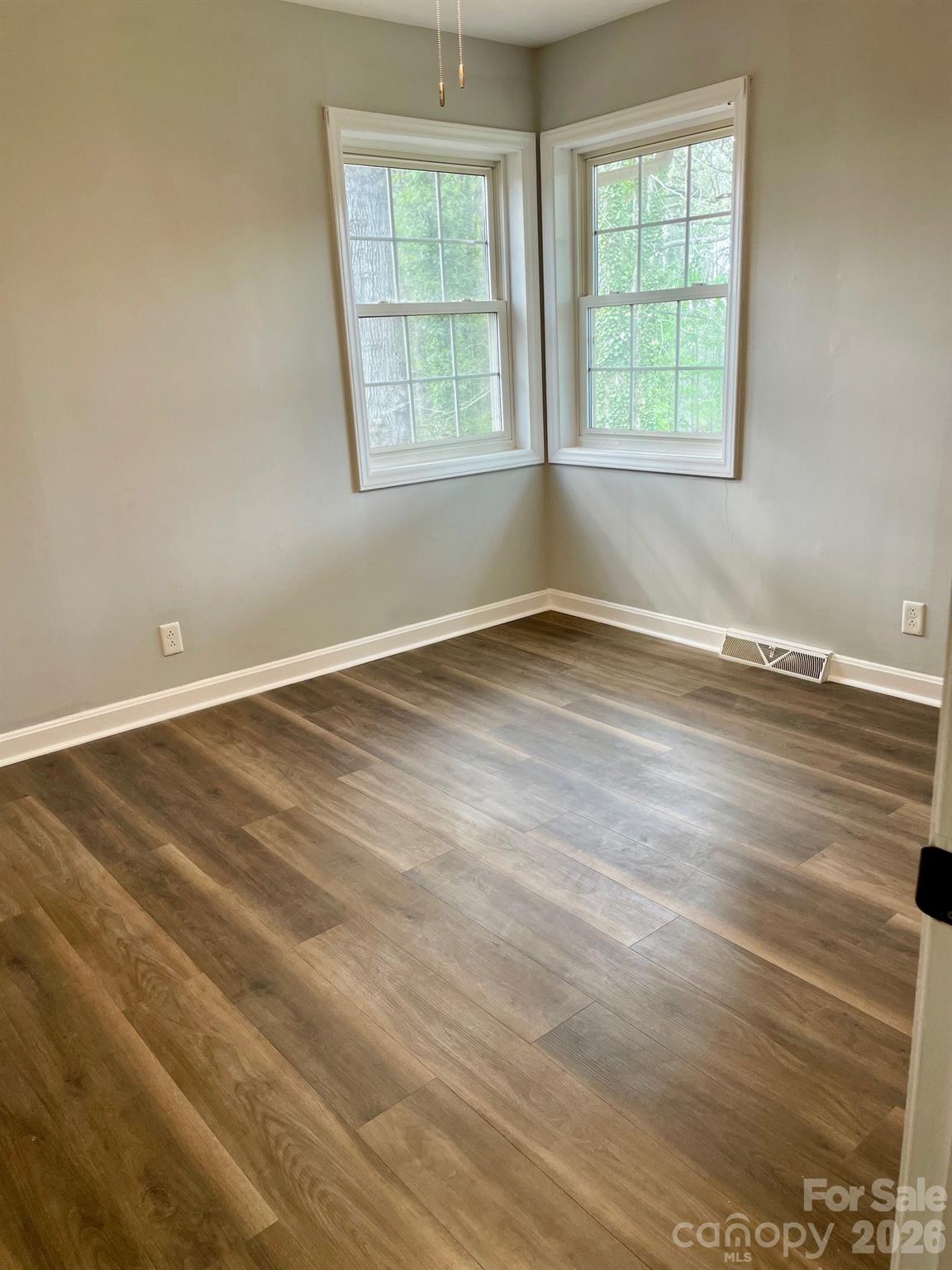 511 Sunbeam Farm Road Cherryville, NC 28021 - Photo 17 of 29 an empty room with wooden floor and windows