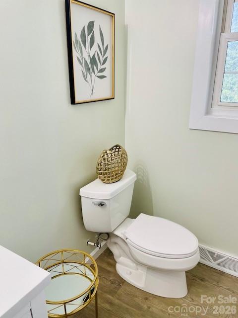 511 Sunbeam Farm Road Cherryville, NC 28021 - Photo 7 of 29 a bathroom with a toilet a sink and a window