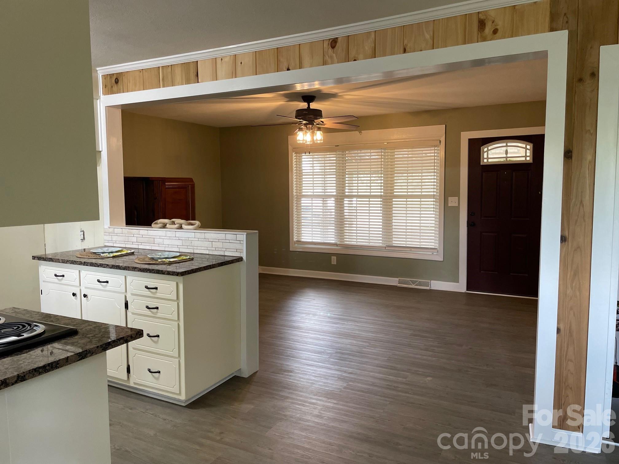 511 Sunbeam Farm Road Cherryville, NC 28021 - Photo 9 of 29 a kitchen with a stove and wooden floor