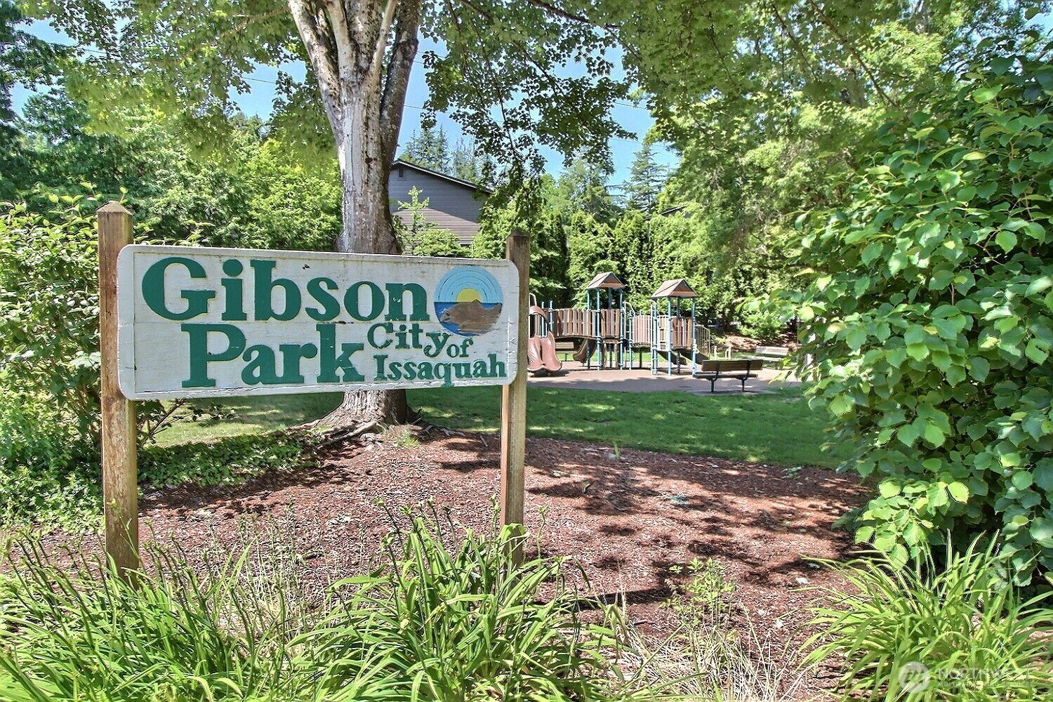 220 Southwest Clark Street, Unit B303 Issaquah, WA 98027 - Photo 15 of 19 a view of a street sign under a large tree