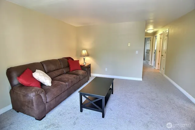 a living room with furniture and a couch