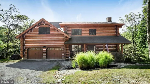 a house that has a tree in front of the house