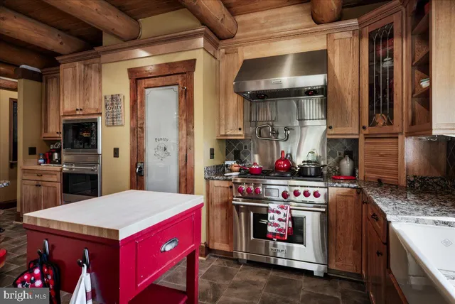 a kitchen with a stove and a refrigerator