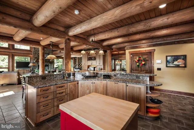 a kitchen with sink stove and cabinets