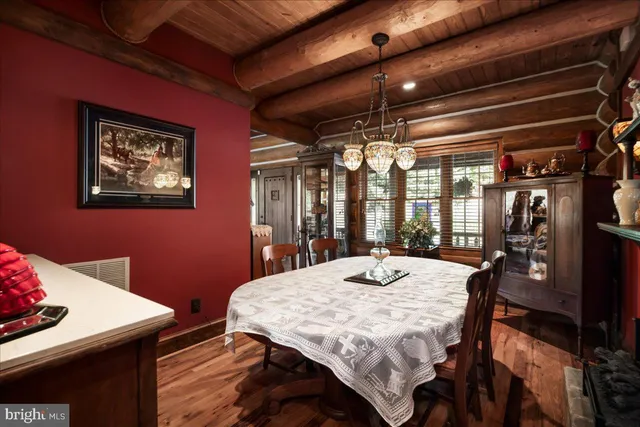 a dining room with a table and chairs