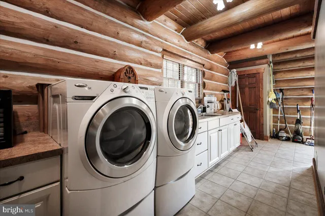 a utility room with dryer and washer