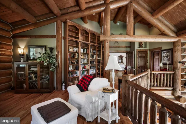 a living room with furniture fireplace and flat screen tv