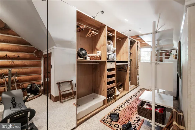 a bed room with wooden floors and lots of furniture