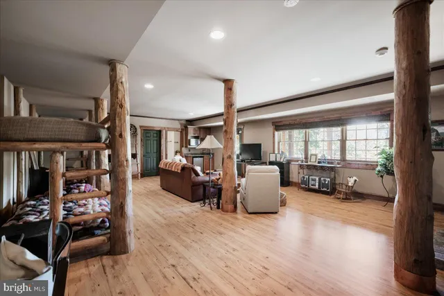 a view of a patio with a table chairs and wooden floor