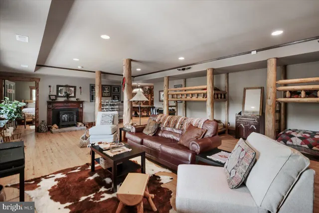 a view of a balcony with wooden floor and outdoor seating