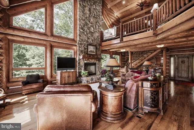 a room with lots of wooden furniture and wooden floor