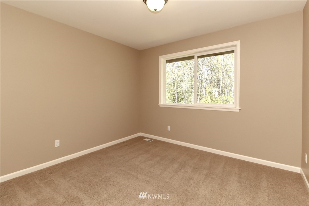 812 South 34th Place Renton, WA 98055 - Photo 22 of 31 an empty room with windows