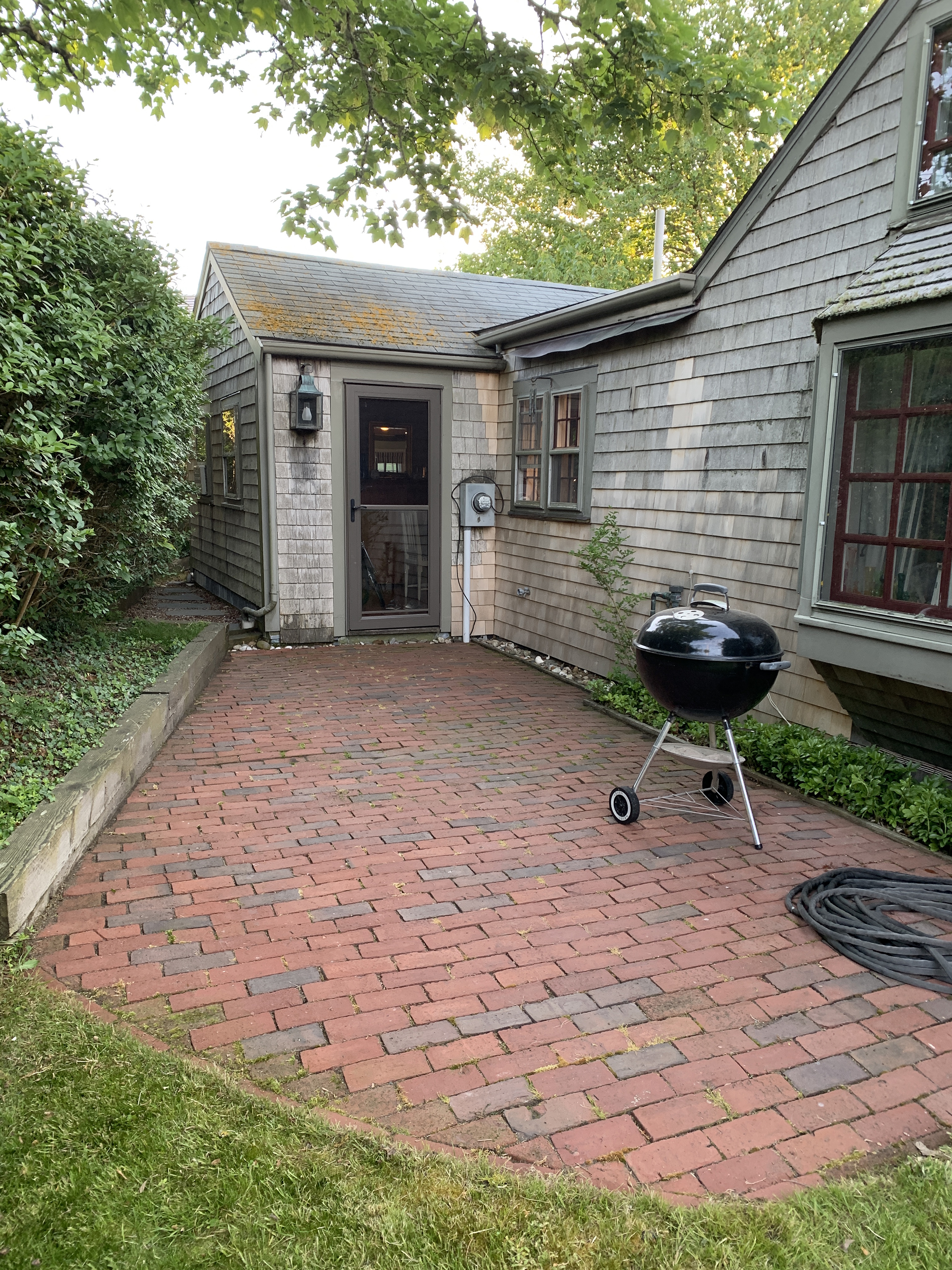 42 North Liberty Street Nantucket, MA 02554 - Photo 20 of 20 a front view of a house with garden