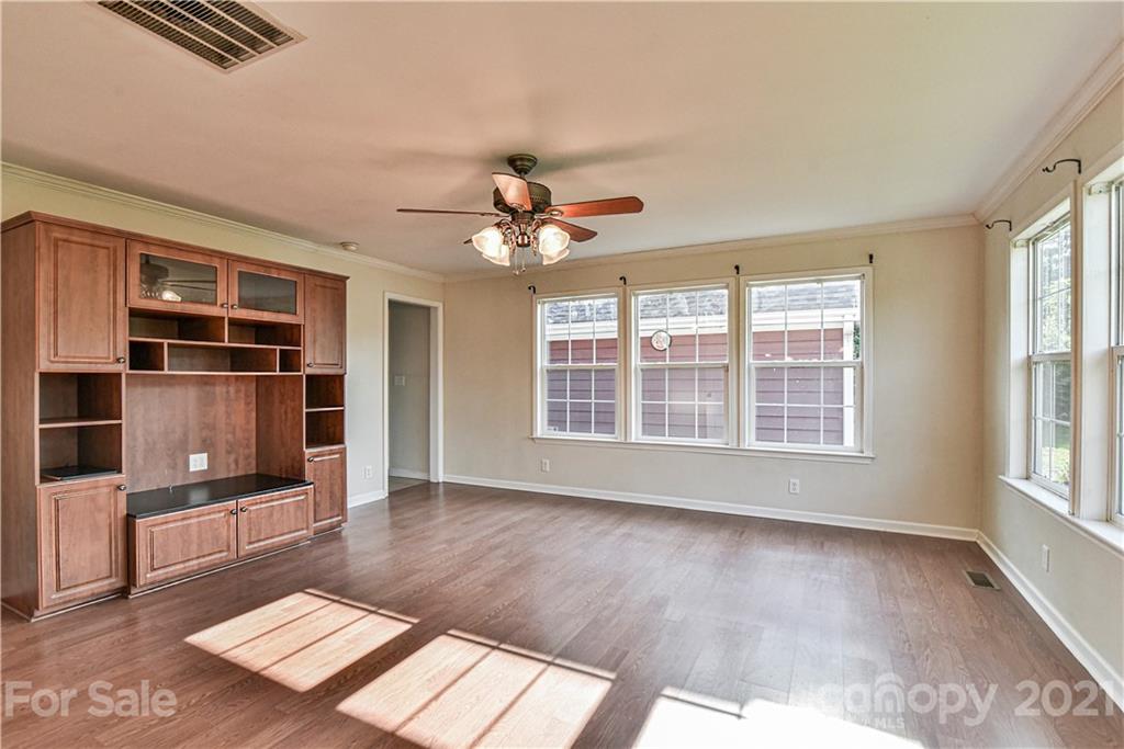 699 Pleasant Hill Road Clyde, NC 28721 - Photo 13 of 32 wooden floor in an empty room with a window