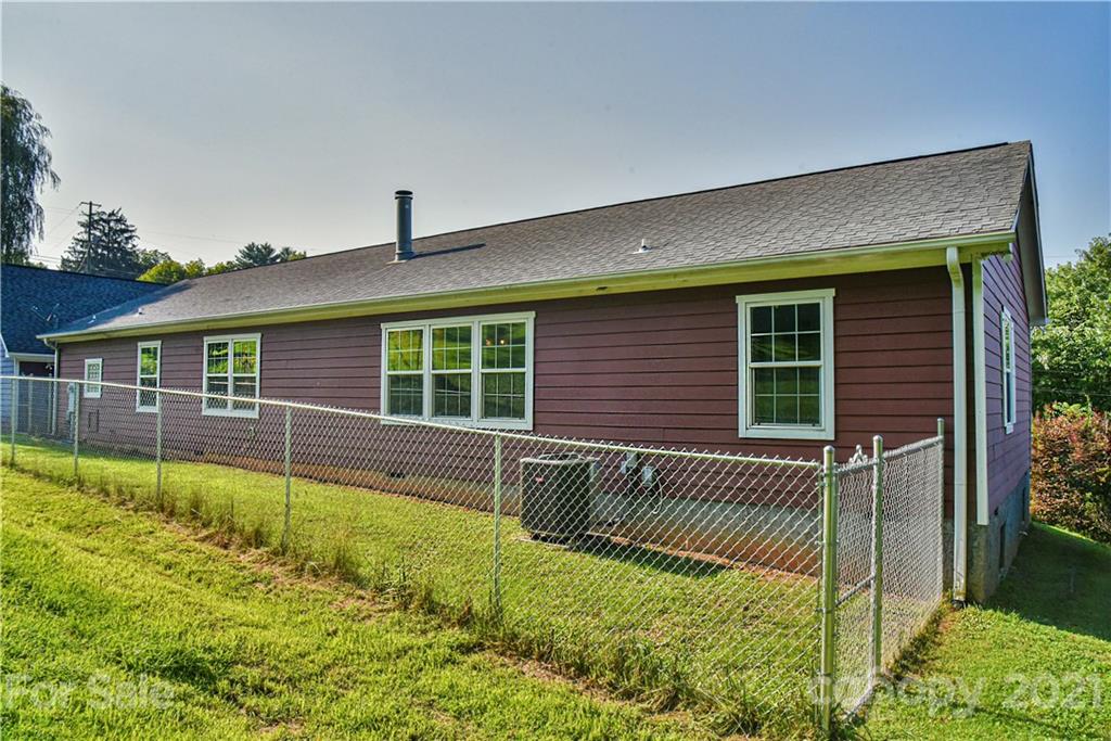 699 Pleasant Hill Road Clyde, NC 28721 - Photo 32 of 32 front view of a house with a swimming pool